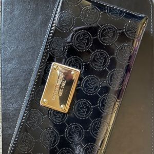 Two MK wallets in excellent condition.